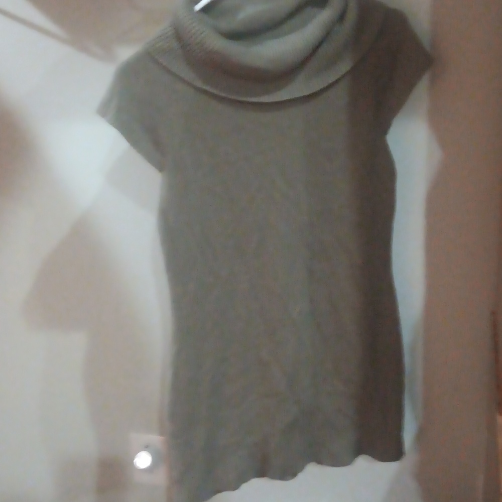 Grayish tan sweater, Is used And has been worn. I would guess a size large.